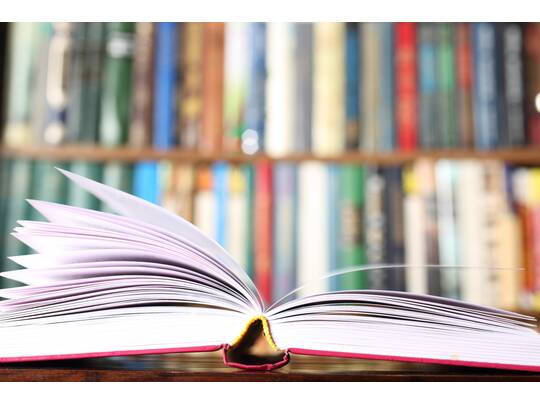 Open Book And Bookshelves